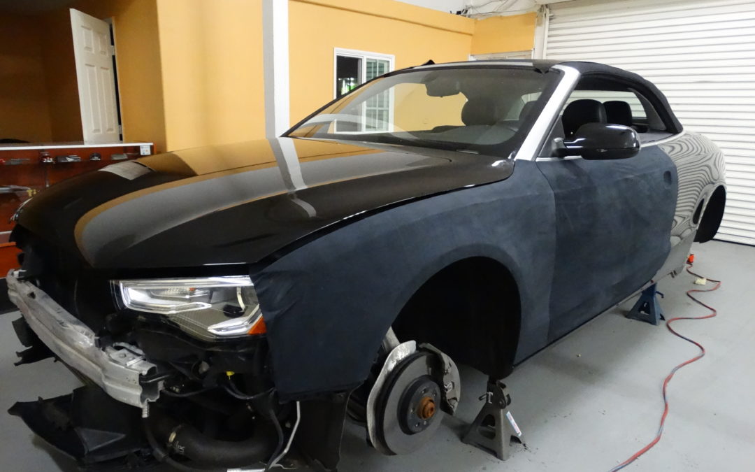 Audi A4 Convertible Black Suede Wrap with Chrome Gold accent.