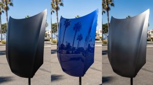 Comparison of matte black, gloss blue, and satin gunmetal car wrap finishes in sunlight