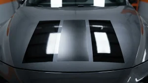 Gloss, satin and high-gloss vinyl wrap film swatches compared on a car hood