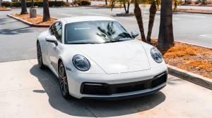 White sports car with paint protection film parked under hot summer sun in San Diego